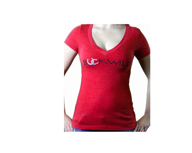 Model wears red v-neck t-shirt with Buckwild logo front.  Back of shirt reads "If you can see this, put me back on my horse" written upside down. 