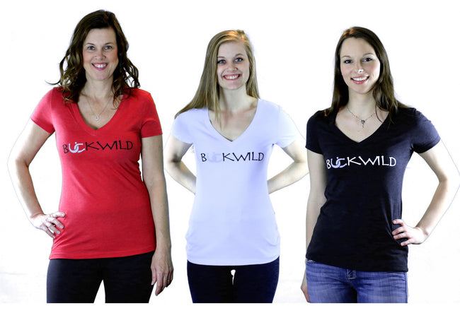 Three models wear red, white and black v-neck t-shirts with Buckwild logo front.  Back of shirt reads "If you can see this, put me back on my horse" written upside down. 